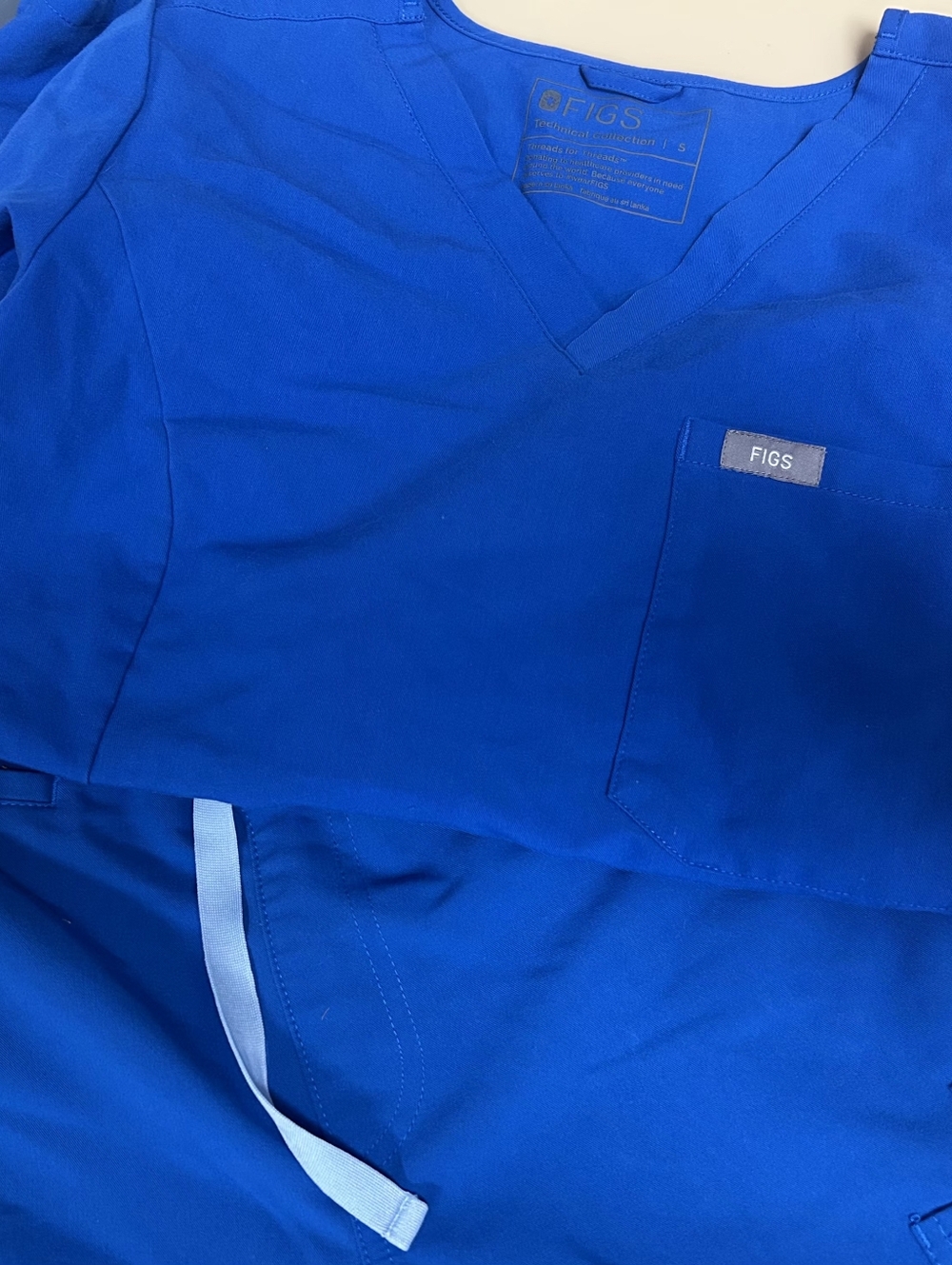 Figs:  XST YOLA pant/SM 1 Pocket Top. Great Condition. Royal Blue